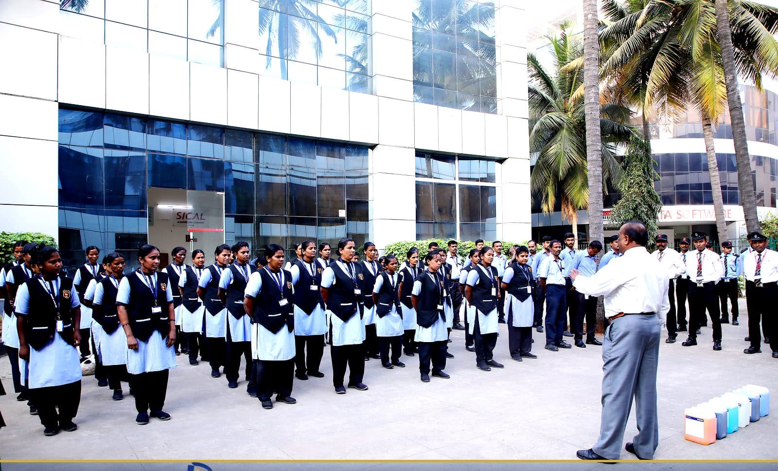 Sajag housekeeping and security teams at a combined morning muster outside a Bengaluru corporate tower